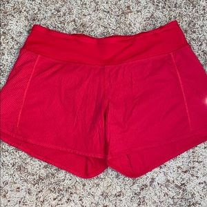 Lululemon red speed up shorts. 4 inch
